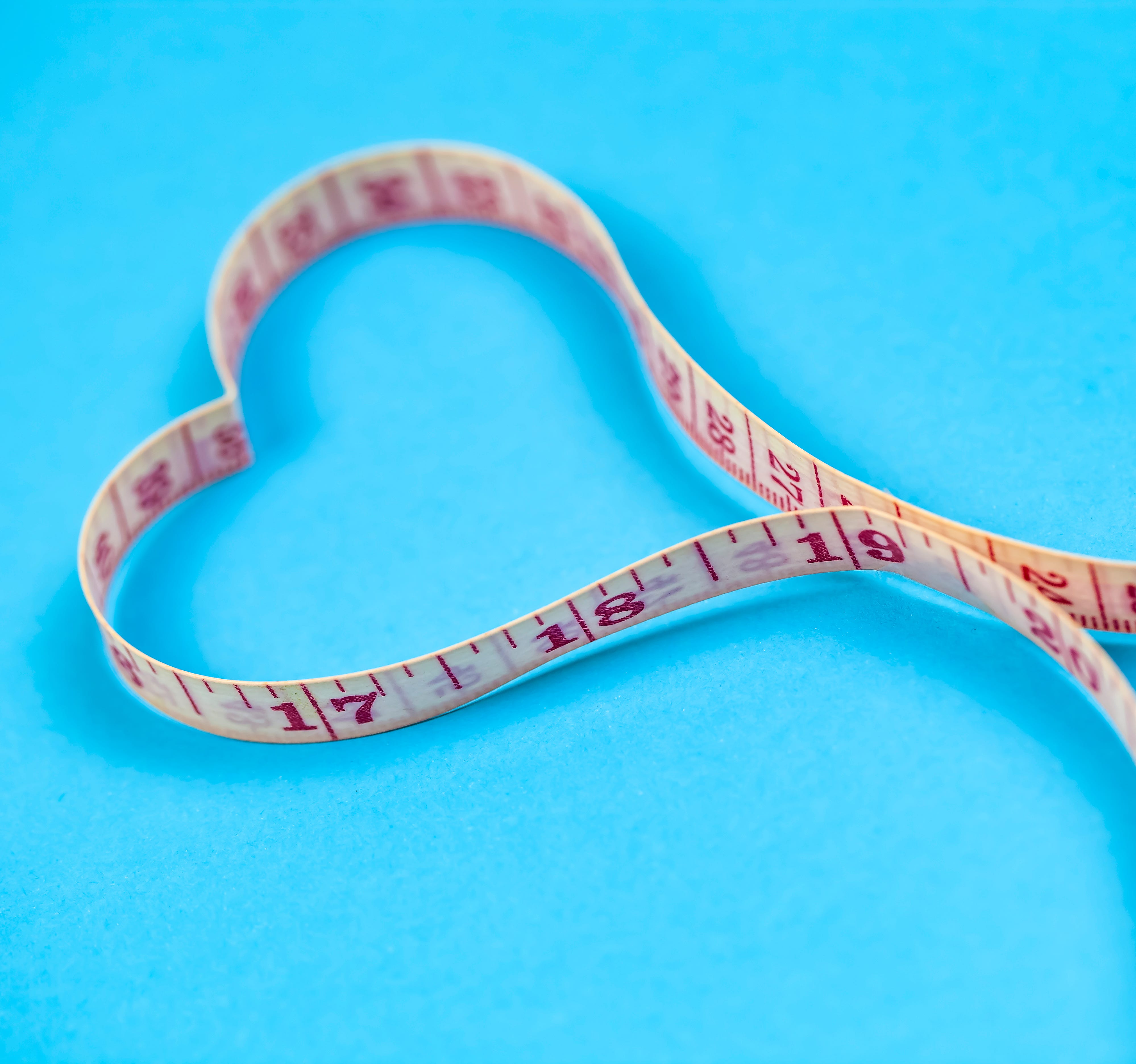 Measuring tape in heart shape. Healthy weight