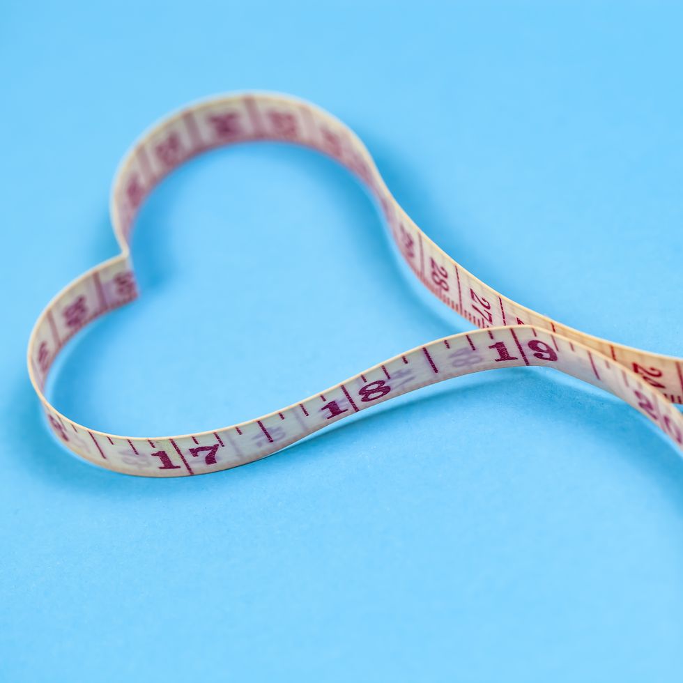 Measuring tape in heart shape. Healthy weight