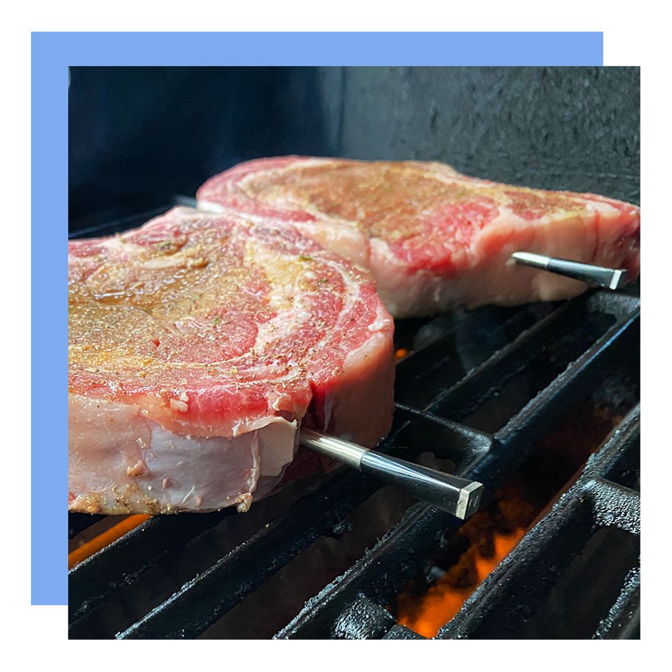 meater inside steak on grill