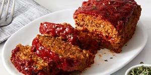 meatloaf sliced and topped with rosemary