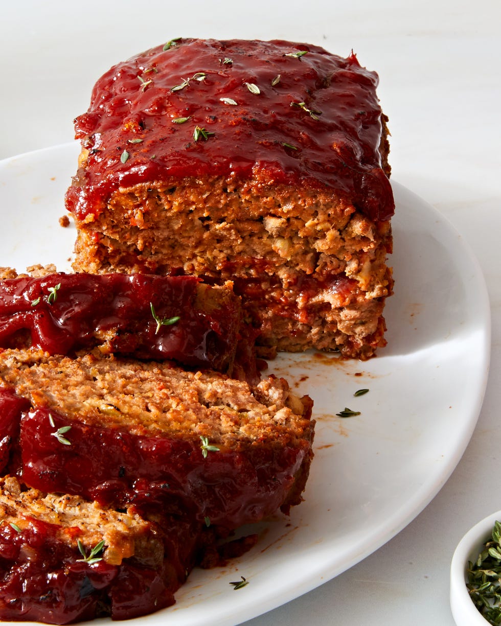 meatloaf sliced and topped with rosemary