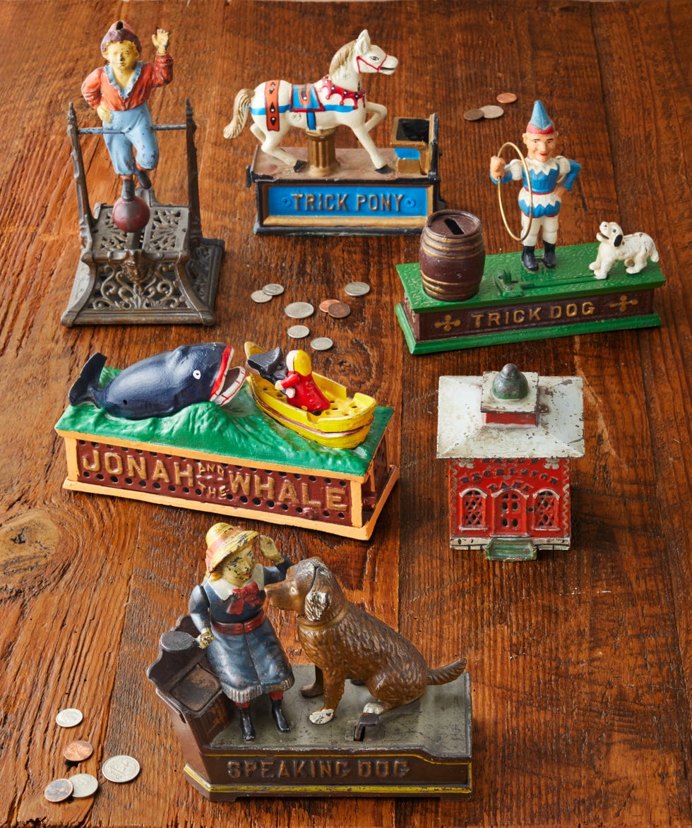 grouping of colorful vintage mechanical coin banks