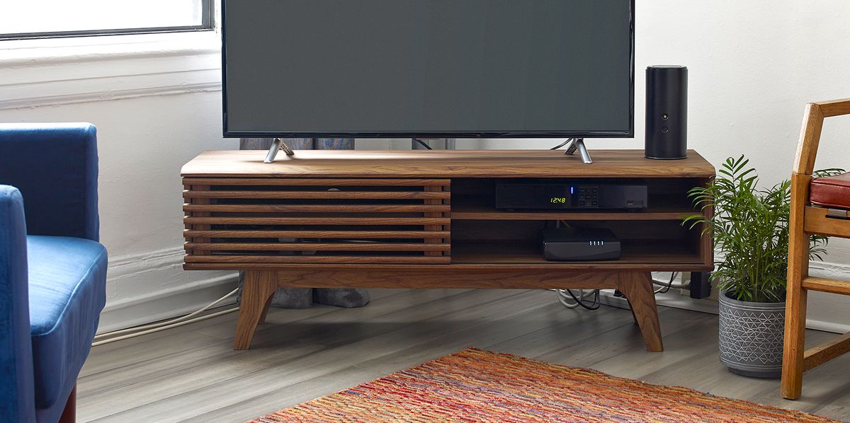 slatted media console with tv in living room