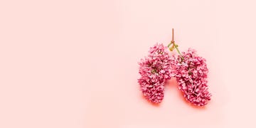 spring allergies medical concept of pink flowers in the form of a light pink background with place for text