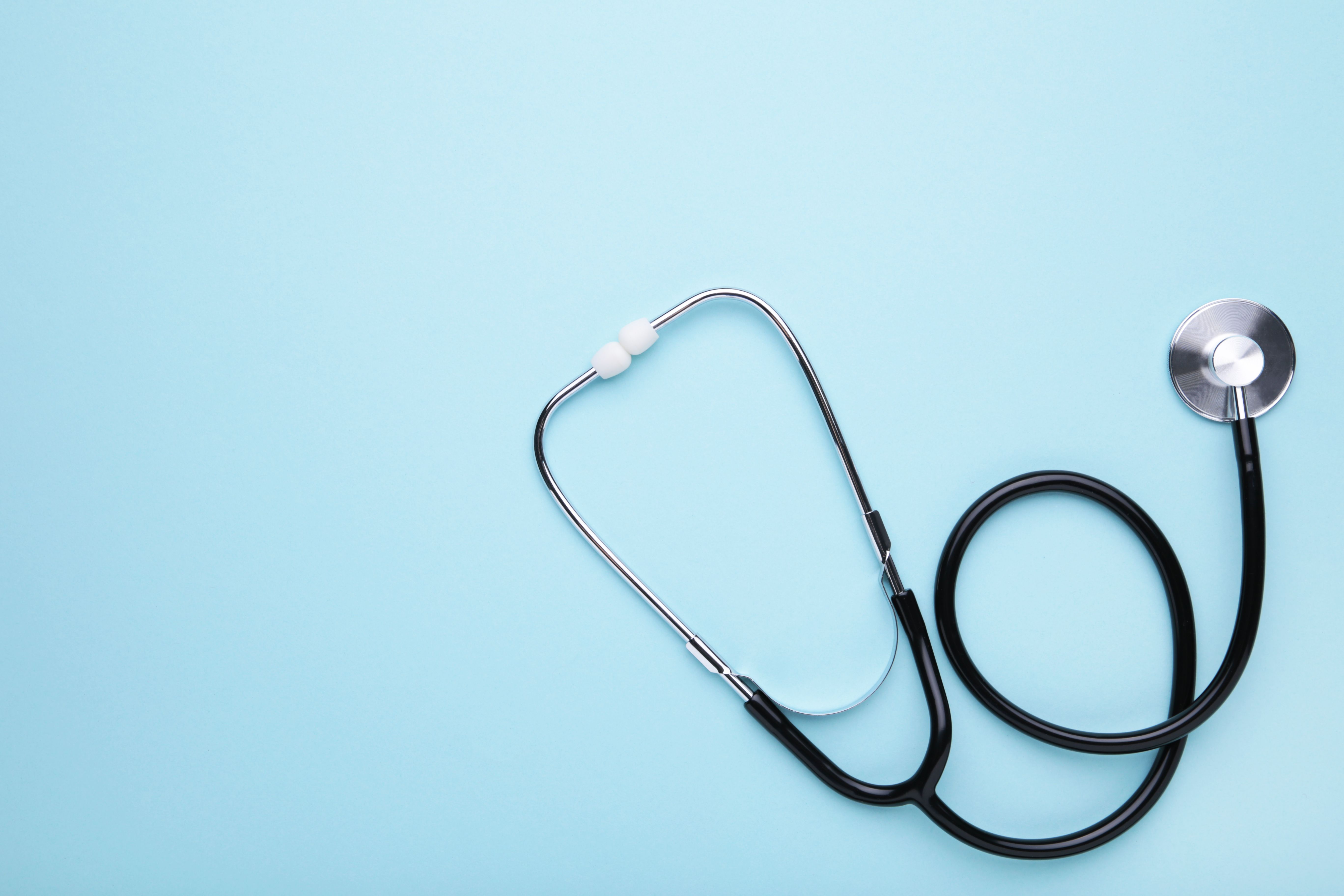 Medical stethoscope on a blue background. Health care concept