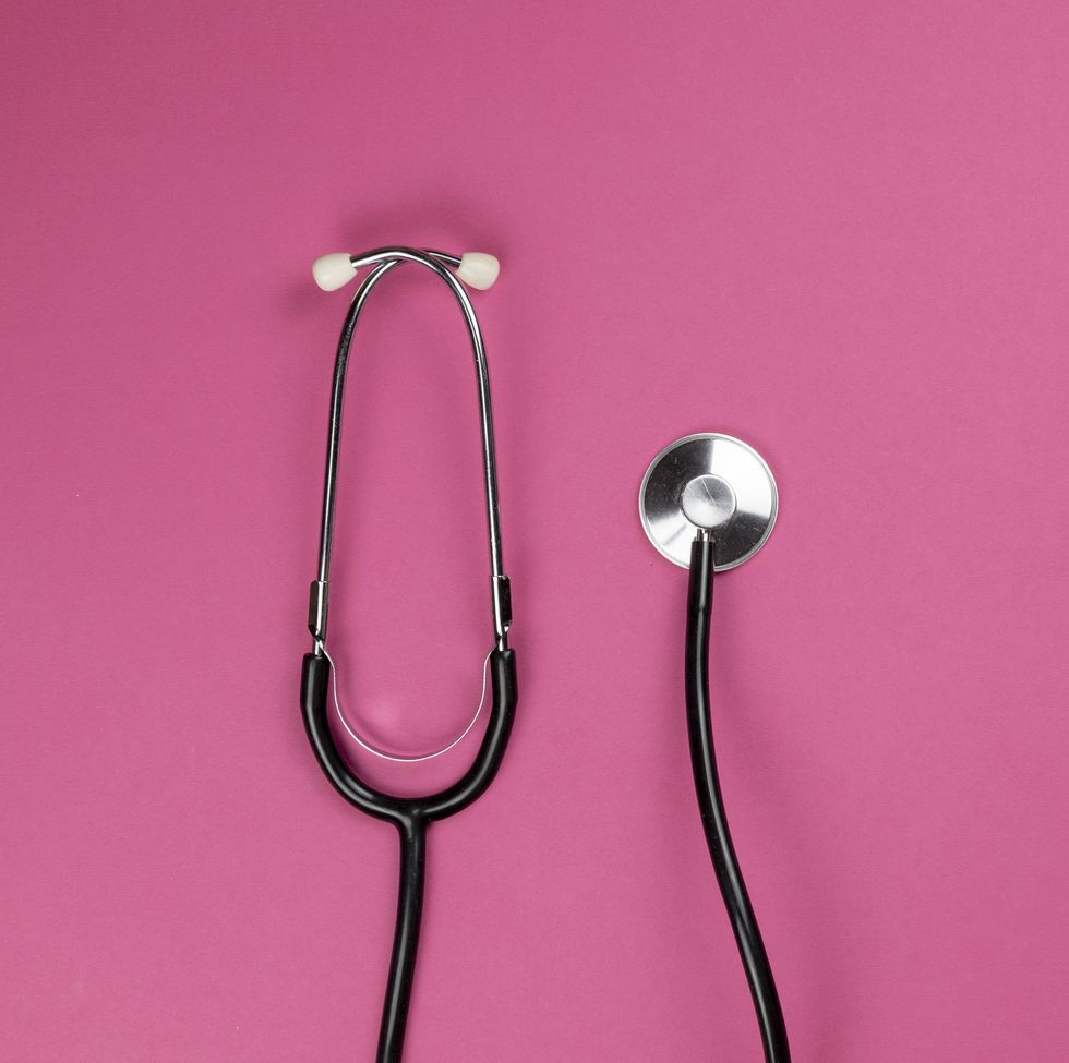 medical stethoscope on pink background helthcare and cardiology background