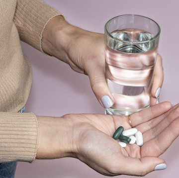 woman holding pills