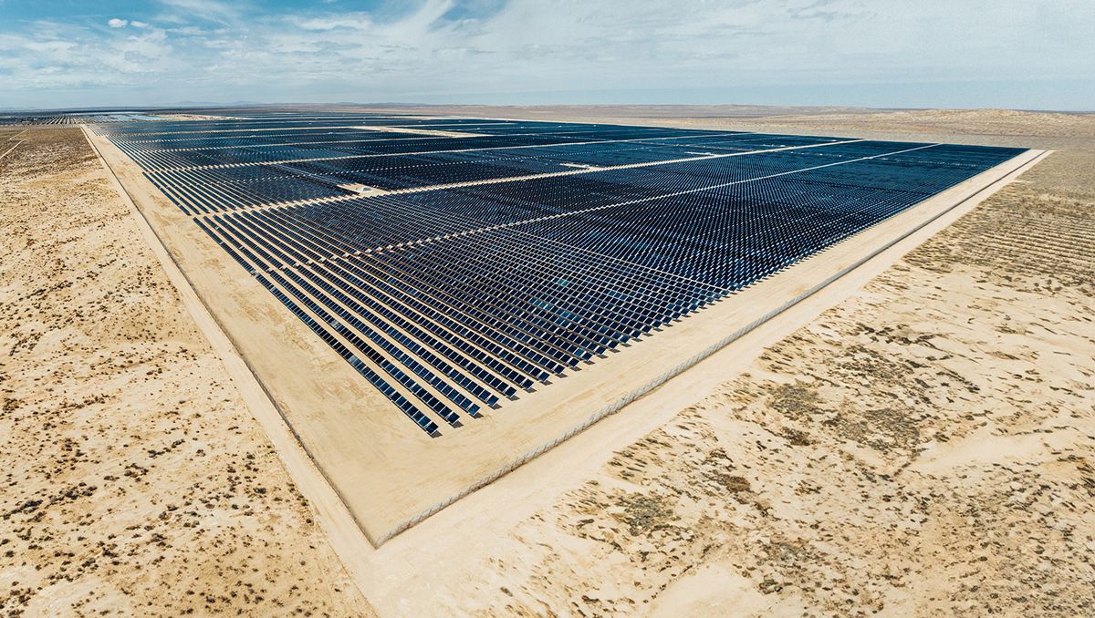 a square shaped solar farm sits in the middle of the desert in southern california on a sunny day