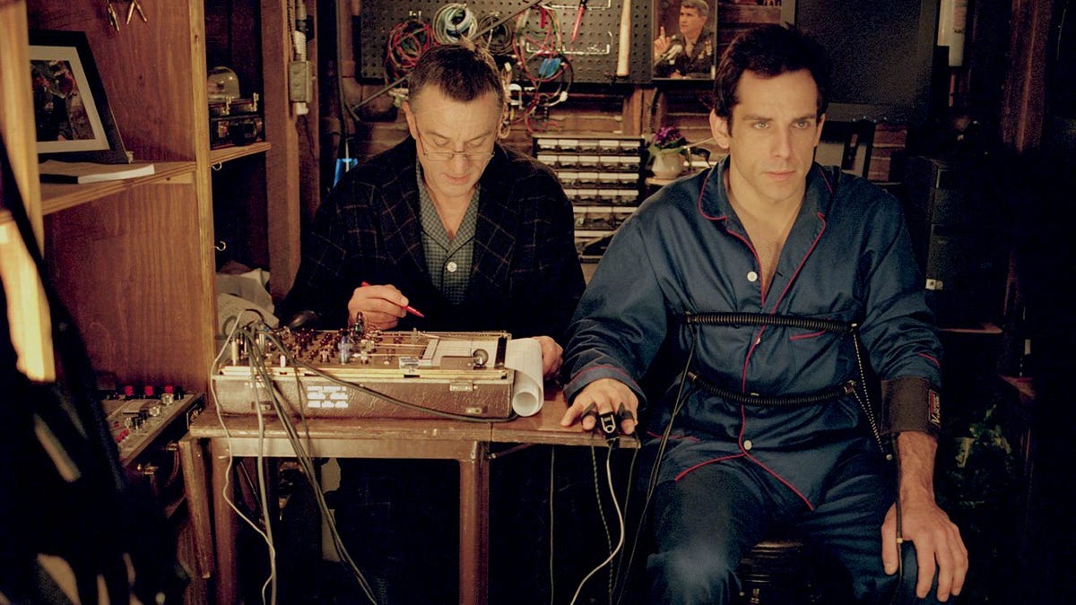 robert de niro and ben stiller, meet the parents, two men sit as one is connected to a polygraph machine