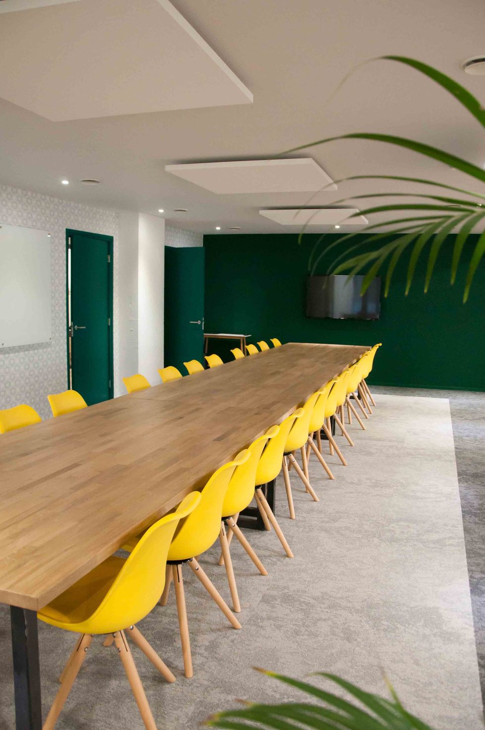 Yellow, Green, Room, Interior design, Table, Conference hall, Architecture, Furniture, Building, Ceiling, 