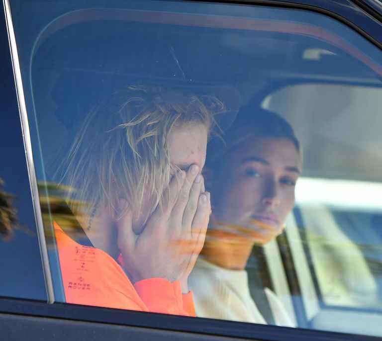 Justin Bieber appears to be crying as he and Hailey Baldwin head to his pastor's home in Beverly Hills