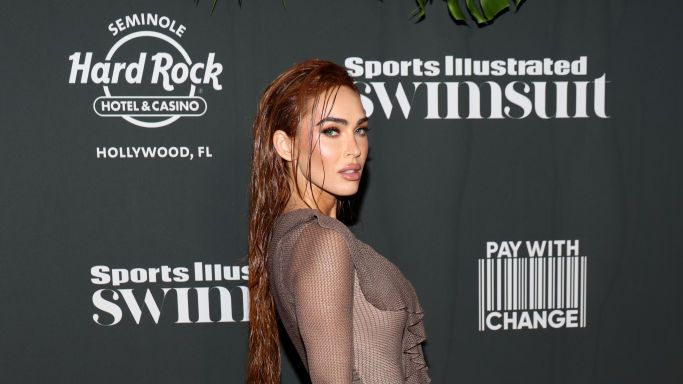 preview for Megan Fox channels Poison Ivy with white feathered hair extensions