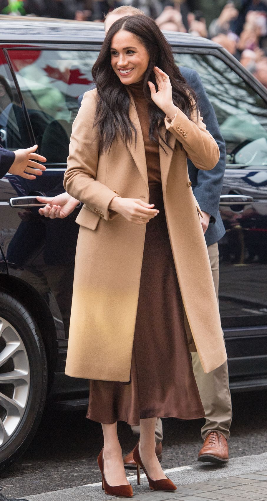 Meghan Markle wears camel coat by Reiss in London