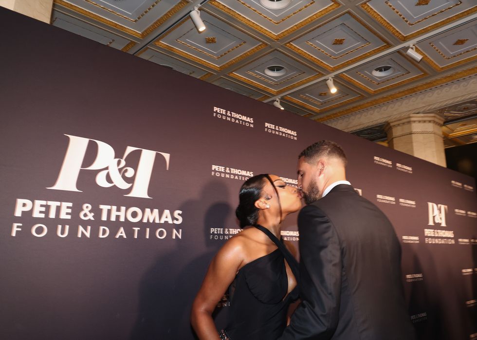 megan thee stallion and klay thompson kissing at the pete and thomas foundation gala