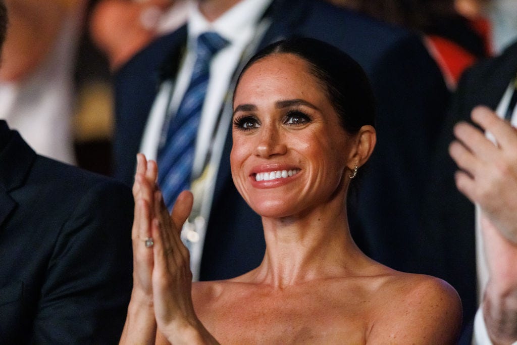 Meghan Markle Wears Chic Salt-And-Pepper Poncho to Kevin Costner's  Fundraiser