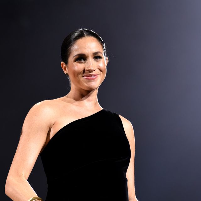 Meghan Markle Wears a Black Gown During Surprise Appearance at British ...