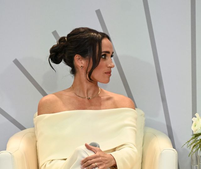 Meghan taps into the off-the-shoulder trend in chic cream ensemble