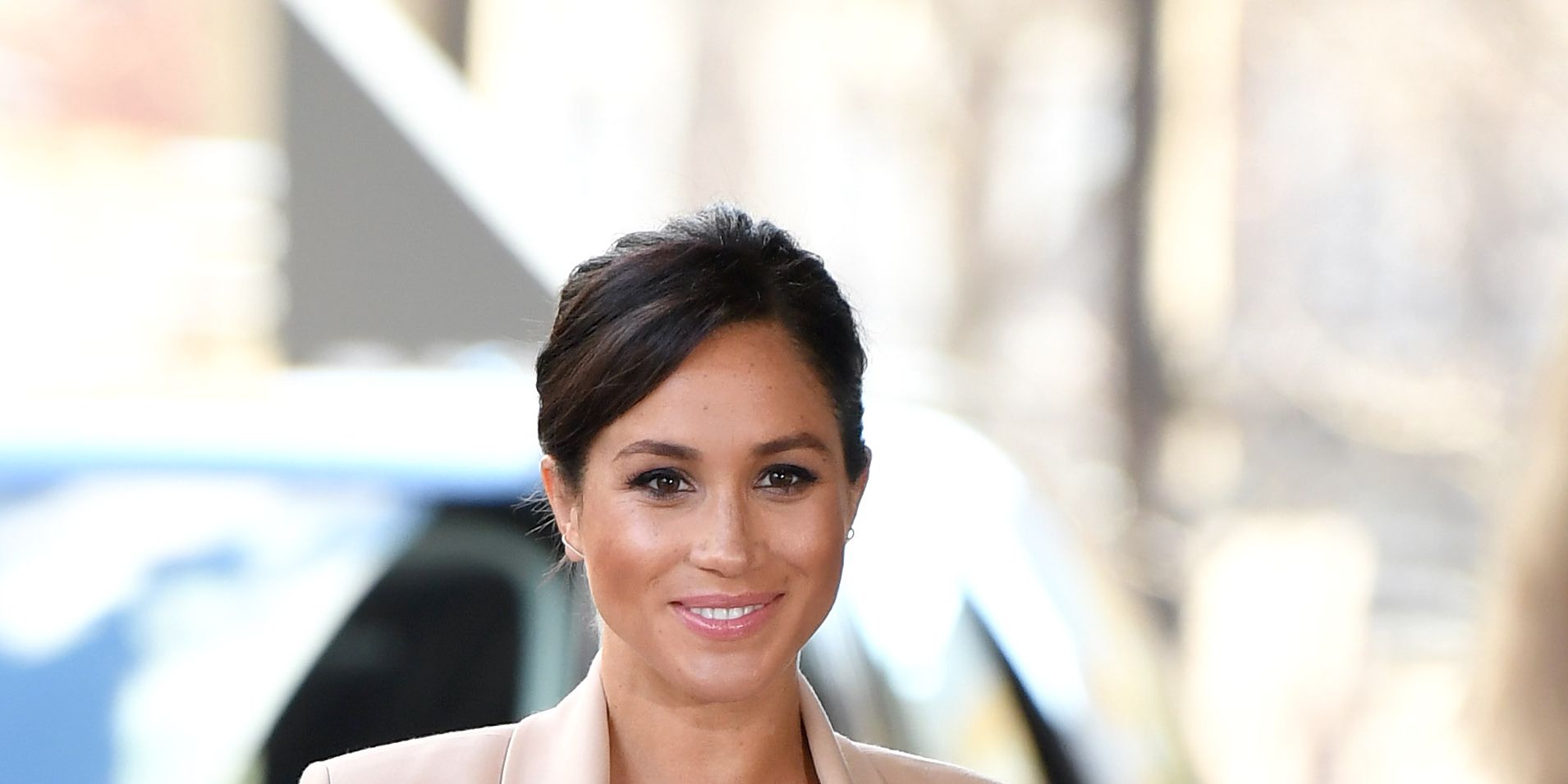 Meghan Markle Wears a Nude Brandon Maxwell Dress and Blazer to Visit the  National Theatre