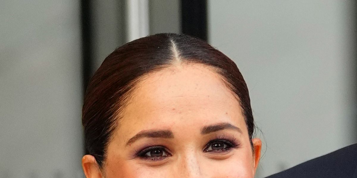 Markle has red-tinted hair trip with Prince Harry