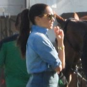 meghan markle in a denim outfit watching prince harry play polo on may 15, 2022