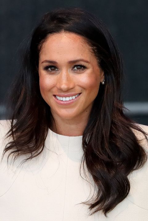 a photo of meghan markle wearing her favorite makeup products,  one of good housekeeping's royal beauty hacks