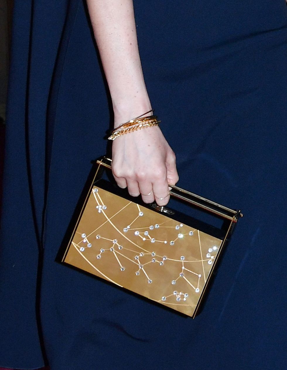 Taylor Swift Just Carried the Same Zodiac Clutch as Meghan Markle - Shop  Similar Styles
