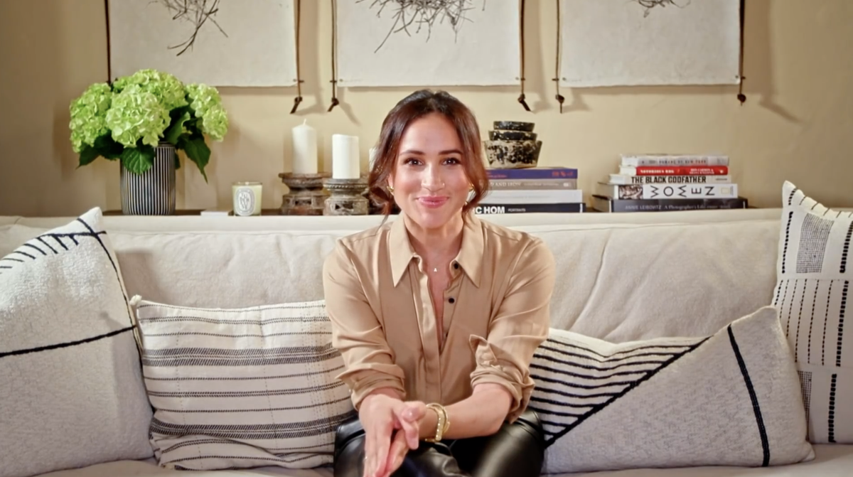 meghan markle sitting in her home home during a video message