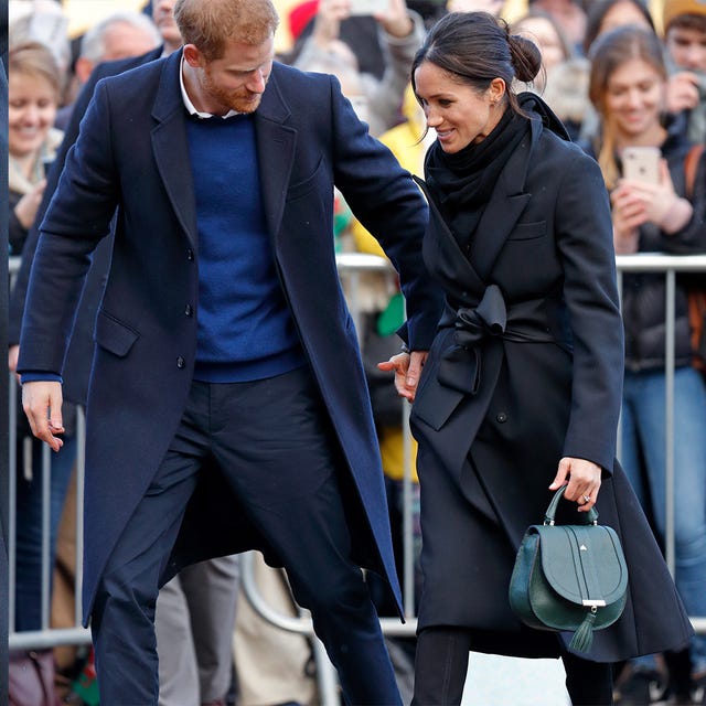 meghan markle seen with prince harry carrying a dark green demellier handbag