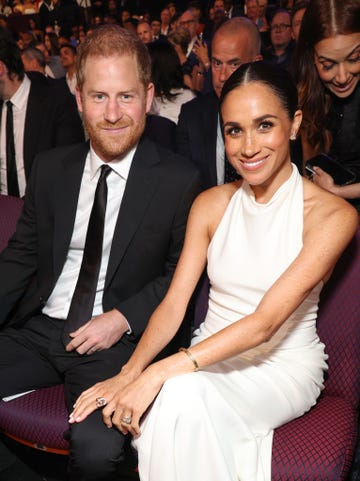 harry and meghan sit side by side