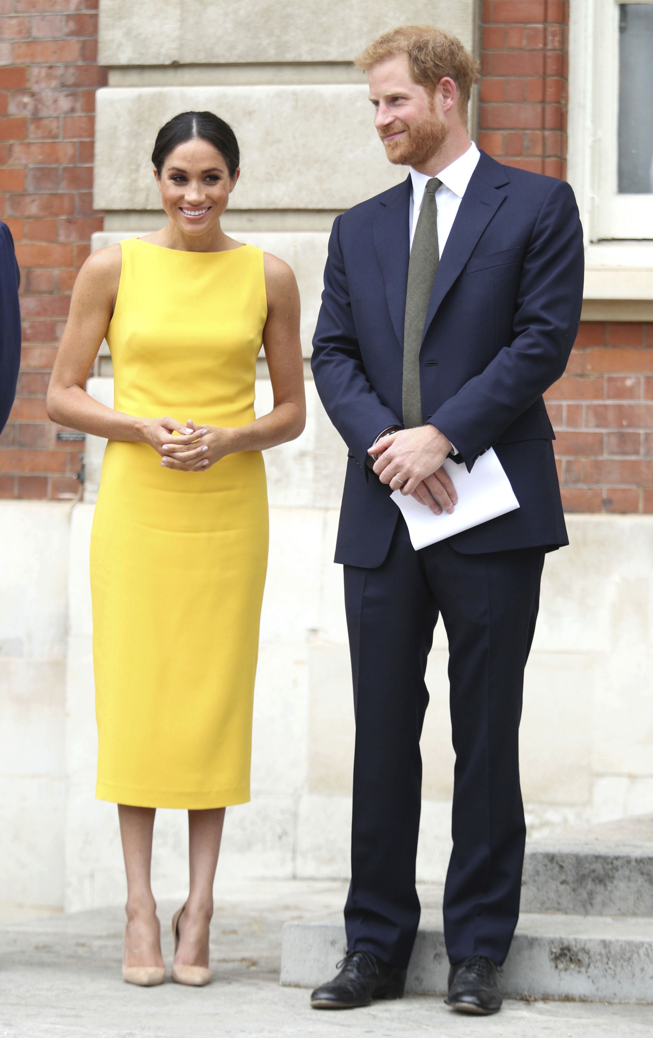 Meghan Markle's 6-Month Baby Bump Is on Full Display in Blush V-Neck Dress  by Brandon Maxwell
