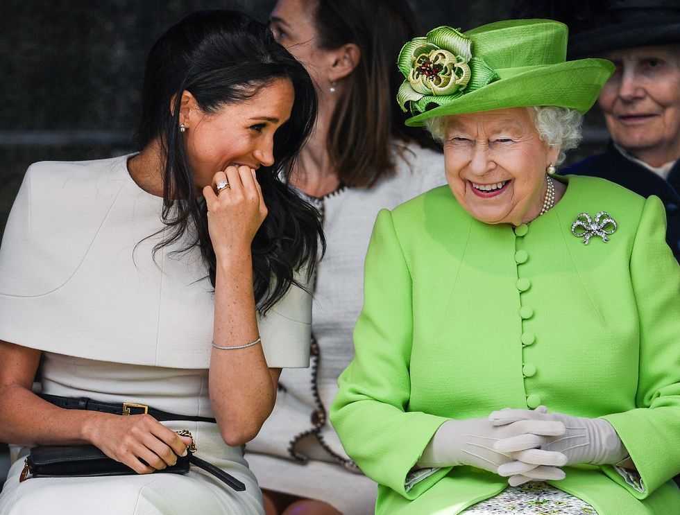 chester, england   june 14  queen elizabeth ii sitts and laughs with meghan, duchess of sussex during a ceremony to open the new mersey gateway bridge on june 14, 2018 in the town of widnes in halton, cheshire, england meghan markle married prince harry last month to become the duchess of sussex and this is her first engagement with the queen during the visit the pair will open a road bridge in widnes and visit the storyhouse and town hall in chester  photo by jeff j mitchellgetty images