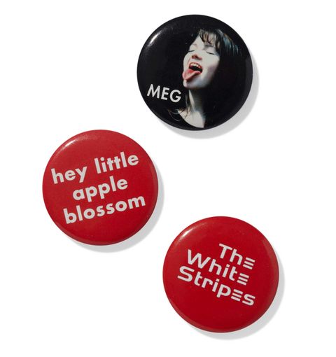 three buttons including one featuring meg white's face