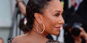 mel b pictured smiling as she turns away from the camera wearing a sequin dress on a red carpet