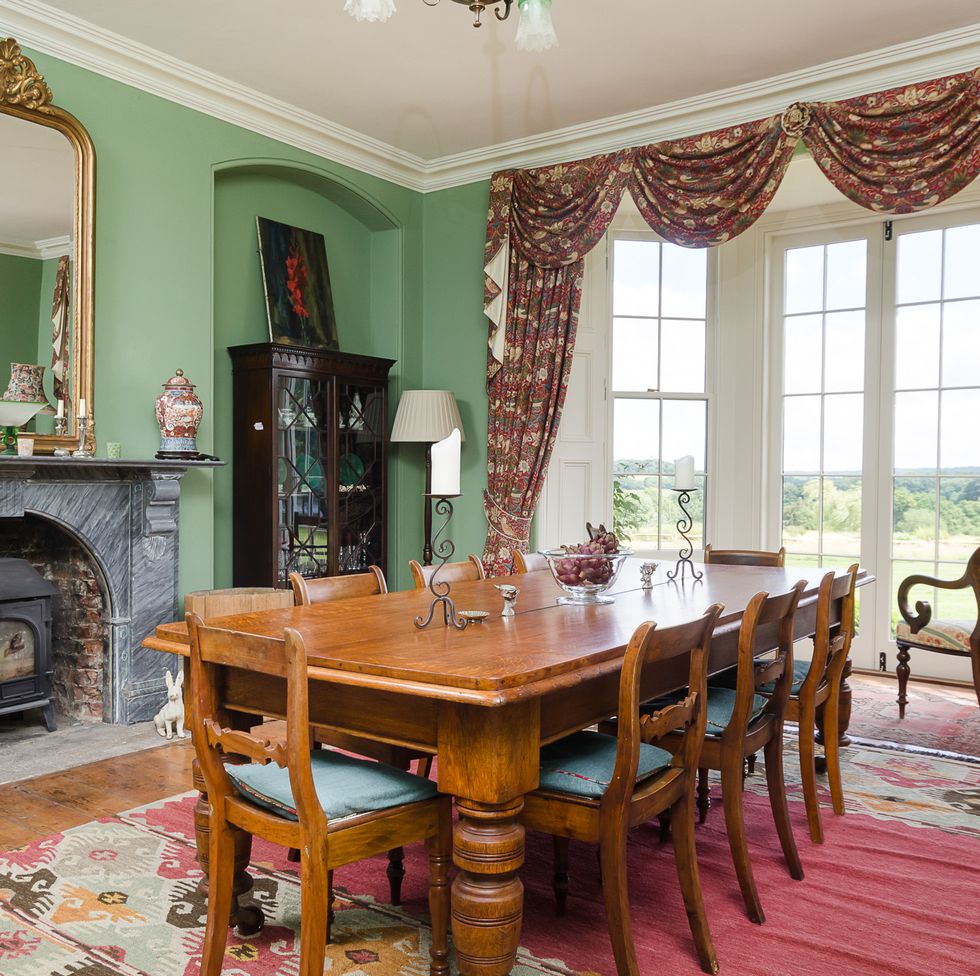 a dining room table with a fireplace