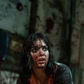 melissa barrera as joey covered in blood in abigail movie
