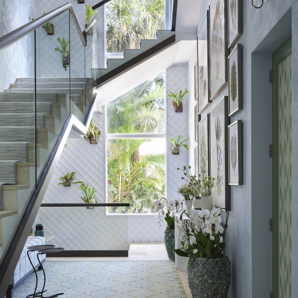a staircase with potted plants