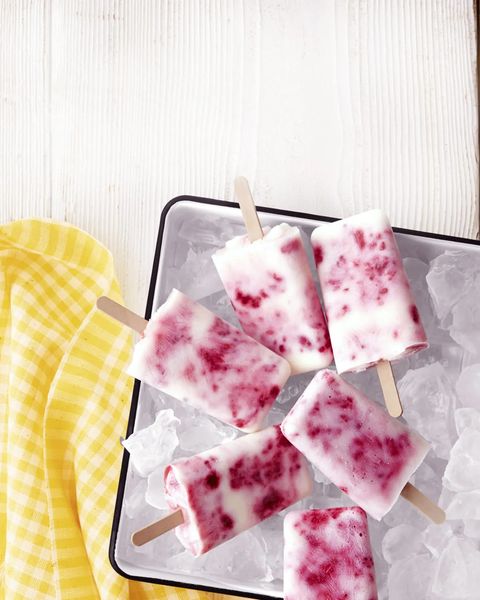 raspberry  buttermilk ice pops in a tray on ice