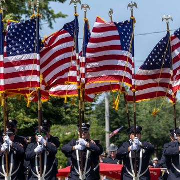freeport, ny members of the freeport fire department hold american flags during the memorial day parade, in freeport, new york, on may 29, 2023 photo by alejandra villa loarcanewsday rm via getty images