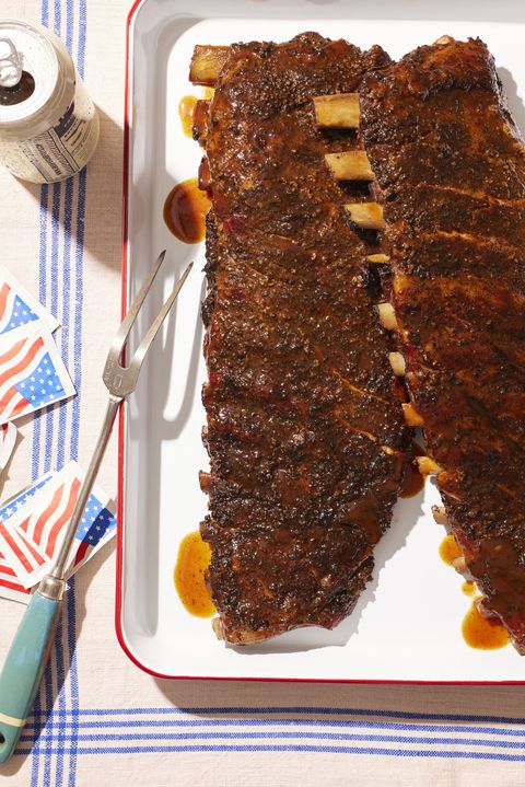 salt and pepper bbq ribs on a table set with red, white, and blue tableware for memorial day
