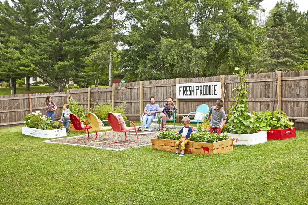 family in a backyard garden with firepit