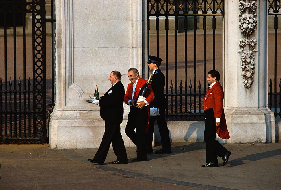 men walking with bottles of champagne