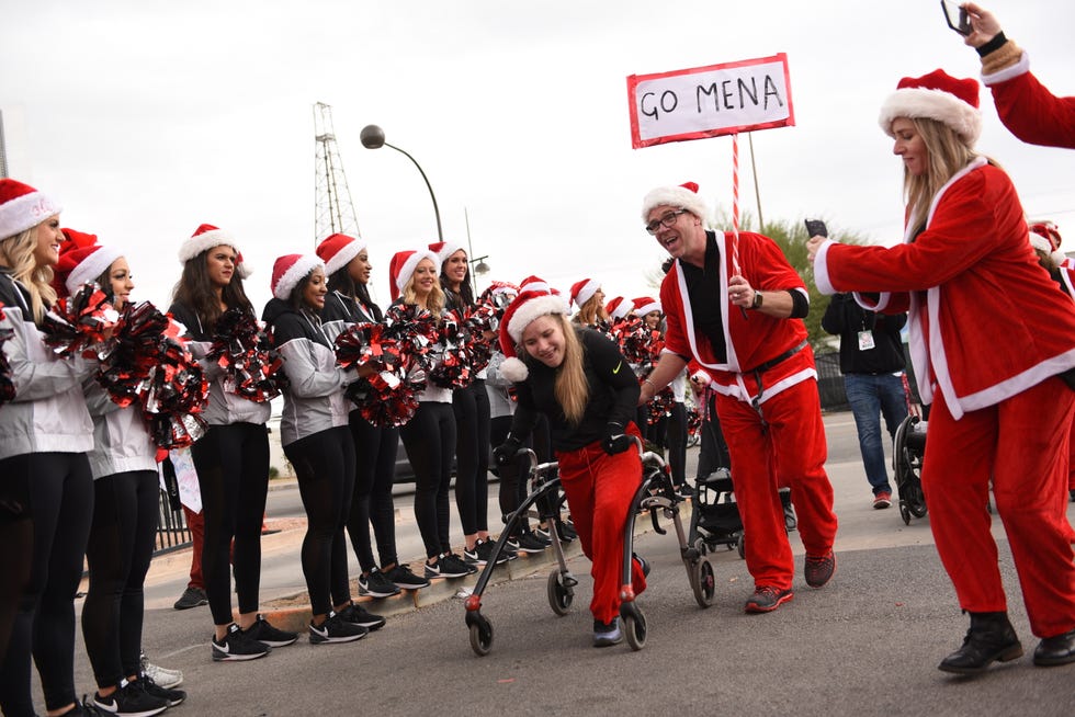 Red, Event, Santa claus, Marching, Parade, Public event, Marching band, Festival, Carnival, Tradition, 