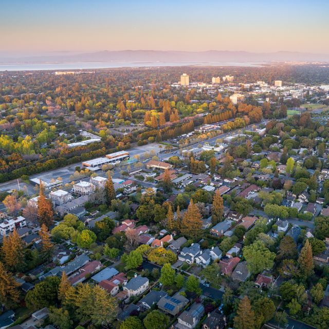 Aerial: Menlo Park suburbs in Silicon Valley at sunset