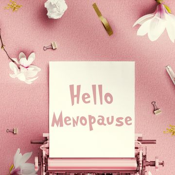 menopause concept typewritter with the word menopause writtenpink background