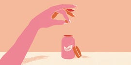 illustrated hand holding supplement pill above a bottle