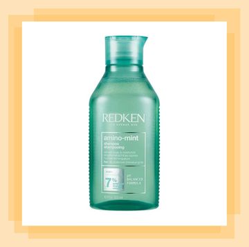 a green bottle of redken shampoo