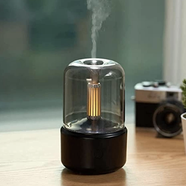 a small black and translucent diffuser and a small portable crockpot