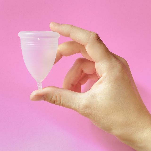 menstrual cup on pink background, feminine hygiene