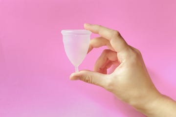 menstrual cup on pink background, feminine hygiene