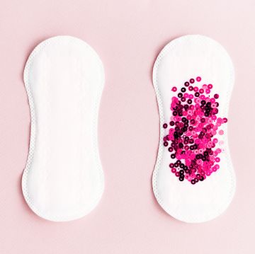 menstrual pad with pink glitter on pastel background